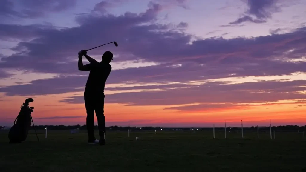 A golfer's silhouette mid-swing