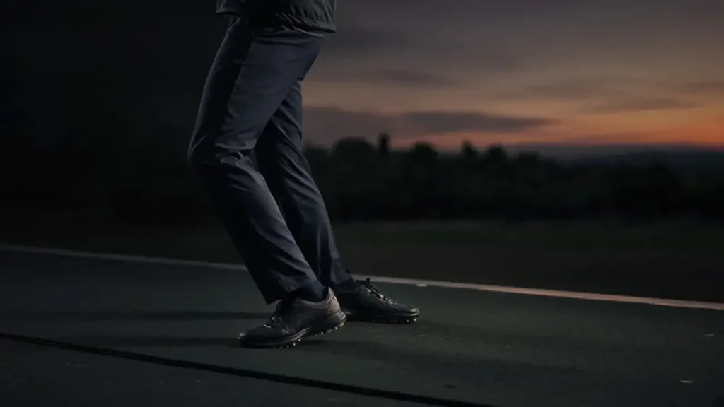 A golfer's silhouette mid-swing